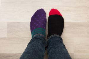 feet with two different socks on